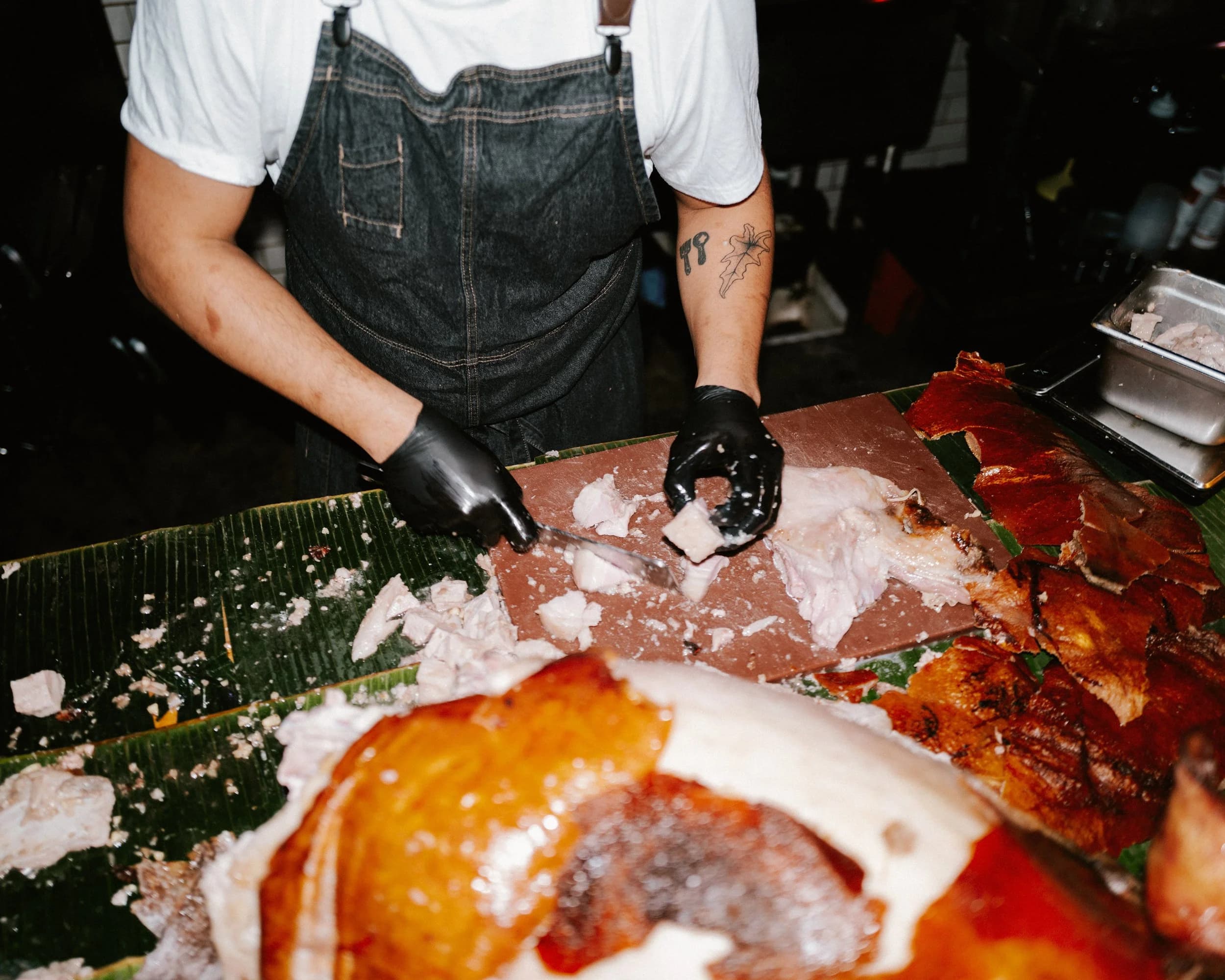 Chef TJ Cruz preparing lechon